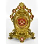 T.A. SIMPSON & CO OF PARIS; a late 19th century gilt metal mantel clock with central porcelain