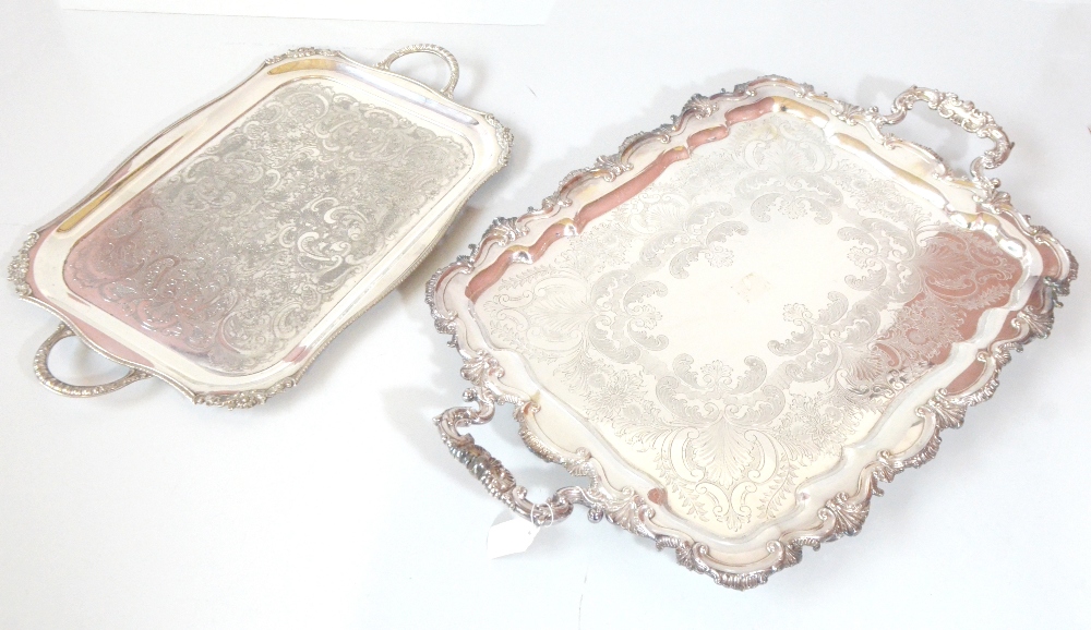 CHARLES HOWARD COLLINS; a silver plated twin handled tray with cast foliate scroll rim and