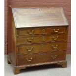 A 19th century oak bureau, the fall front enclosing fitted interior above four drawers, raised on