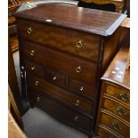 STAG MINSTREL; a narrow chest of seven drawers, raised on block supports, height 112cm, width