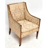An Edwardian line inlaid mahogany armchair with floral upholstery on tapering block supports to