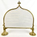 A late Victorian/Edwardian brass framed mesh spark guard with bead decorated weighted end