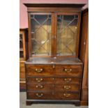 A George III mahogany secretaire bookcase, the later upper section with twin astragal glazed