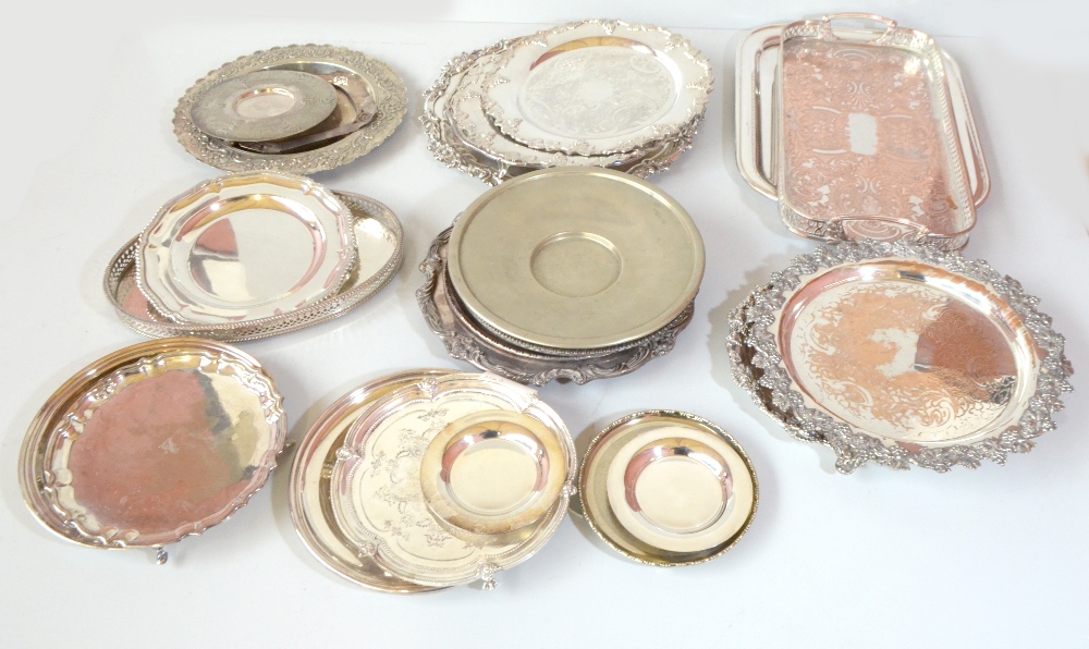 A group of silver plated trays and salvers including J.B. C&S Ltd example with foliate scroll cast