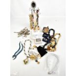 A mixed group of costume jewellery and various base metal teaspoons.