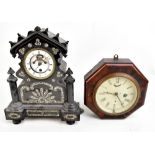 A Victorian ebonised mantel clock with mother of pearl inlaid decoration surrounding a circular