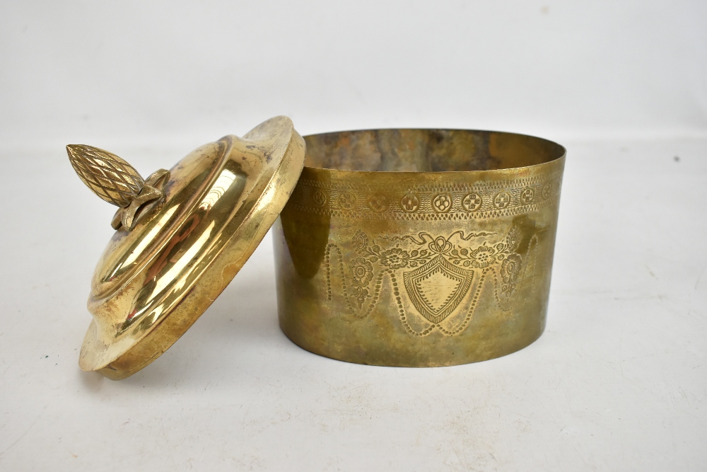 A decorative brass biscuit box with pineapple finial and engraved detail, length 17cm.Additional - Image 2 of 2