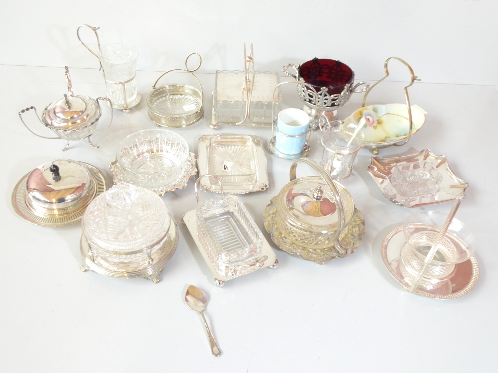 A group of silver plated and mounted butter dishes, sugar bowls and condiment sets including