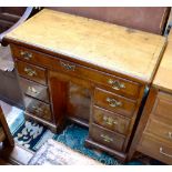 A late George II/early George III walnut crossbanded and line inlaid kneehole desk with frieze