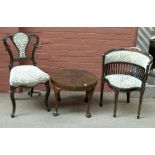 An Edwardian stained and inlaid mahogany salon tub chair with rosewood and marquetry panel to top