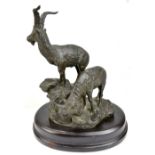 IN THE MANNER OF JULES MOIGNIEZ; an early/mid-20th century bronze figure group depicting two rams