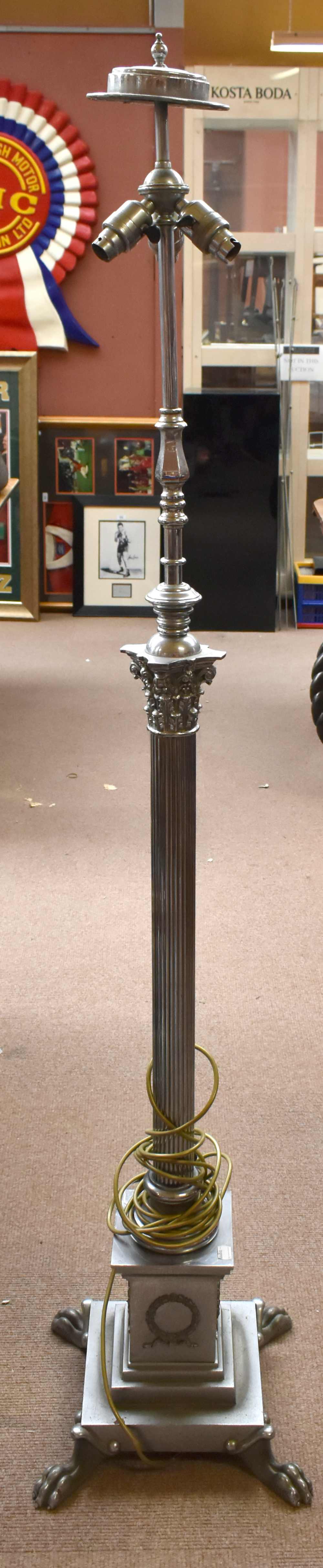 An early 20th century chromed Corinthian column standard lamp with three sockets and stepped section