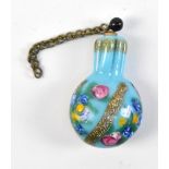 A miniature scent bottle with enamelled floral and gilt detail, with stopper, length 3.2cm, with