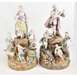 A large and impressive pair of late 19th century Continental porcelain figure groups, both featuring