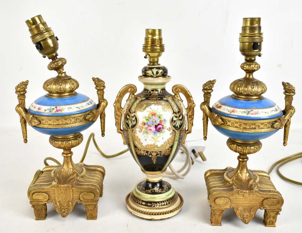 A pair of French early 20th century gilt metal mounted porcelain table lamps, height including