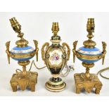 A pair of French early 20th century gilt metal mounted porcelain table lamps, height including
