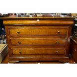 A reproduction mahogany veneered chest with two secret drawers above six long drawers on bracket