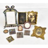 An interesting collection of frames including a large brass champlevé enamel decorated easel back
