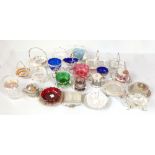 A group of silver plate mounted glass butter dishes and condiment bowls including a cranberry