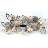 A group of silver plated teaware including a four part tea service with engine turned decoration