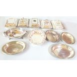 A group of silver plated entrée dishes including examples with cast foliate scroll and shell detail,