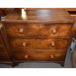 An early 19th century oak straight front chest of three drawers, raised on bracket feet, height