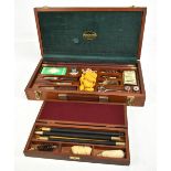 JAMES PURDEY & SONS; a teak cased shotgun cleaning set and a similar larger example (2).