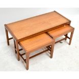 A mid-20th century teak nest of coffee tables, height of largest 41cm, length 99cm, depth 43cm.