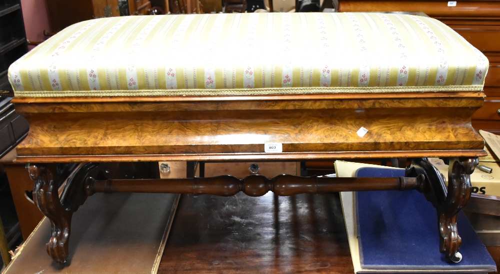 A 19th century burr walnut veneered duet piano stool with hinged seat enclosing storage compartment,