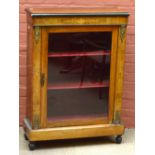 A Victorian walnut part ebonised and inlaid pier cabinet with glazed door enclosing velvet lined