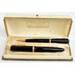 PARKER; a 'Demi' Duofold fountain pen with 14k nib and matching pencil in original box.Additional