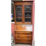An early 20th century mahogany bureau bookcase, the upper section with Art Nouveau stained and