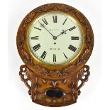 A Victorian carved oak drop dial wall clock with applied detail of acorns and oak leaves surrounding