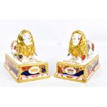 ROYAL WORCESTER; a pair of Trafalgar Lions from the Nelson collection, printed marks to base,