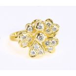 An 18ct yellow gold and diamond floral cluster stepped ring, size M 1/2, approx 6.5g.