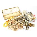 A quantity of various costume jewellery to include a 9ct gold wishbone and floral brooch and a pair