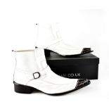 Gucinari; a pair of gentlemen's white leather Chelsea boots with sewn decoration and metal toe cap,