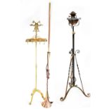 A quantity of brass and metal ware to include an iron and brass standard oil lamp, height 144cm,