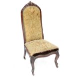 A Victorian walnut nursing chair with acanthus carved surmount, on cabriole legs,