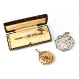 A cased Edwardian emerald and diamond bar brooch,