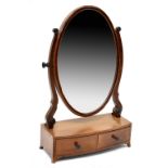 An Edwardian inlaid mahogany swing toilet mirror with oval mirror plate on scroll uprights,