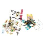 A mixed lot of costume jewellery to include necklaces, wristwatches, brooches including a parrot,