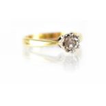 An 18ct gold solitaire diamond ring, brilliant-cut in white gold claw mounts, stamped 750, maker GJ,