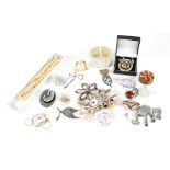 A mixed lot of costume jewellery to include brooches, one in the form of a crab set with diamanté,