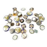 A collection of vintage ceramic and white metal gilt-heightened and enamelled buttons.