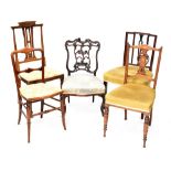 Five chairs to include an Edwardian inlaid mahogany salon chair with pierced vase splat and