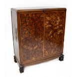 An early/mid-20th century Chinese oak and hardwood cabinet with fitted interior,