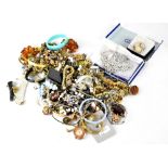 A large quantity of mixed costume jewellery to include earrings, necklaces, silver, brooches, etc.