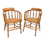 A pair of Edwardian matched captain-style chairs (2).