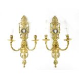 Five Neo-Classical style gilt brass twin-branch wall-hanging sconces,